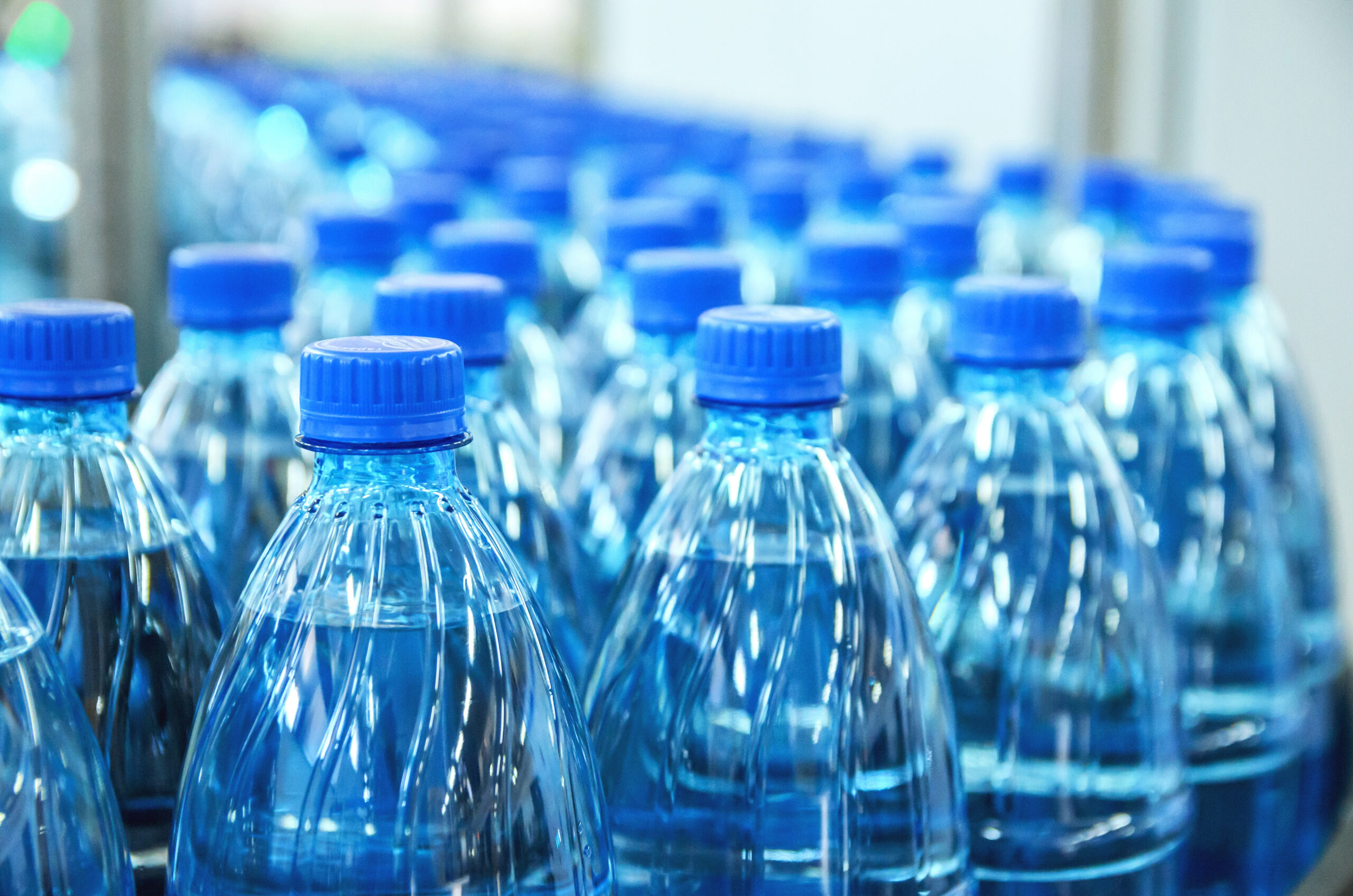 Closeup,On,Mineral,Water,Bottles,In,Raw,And,Lines